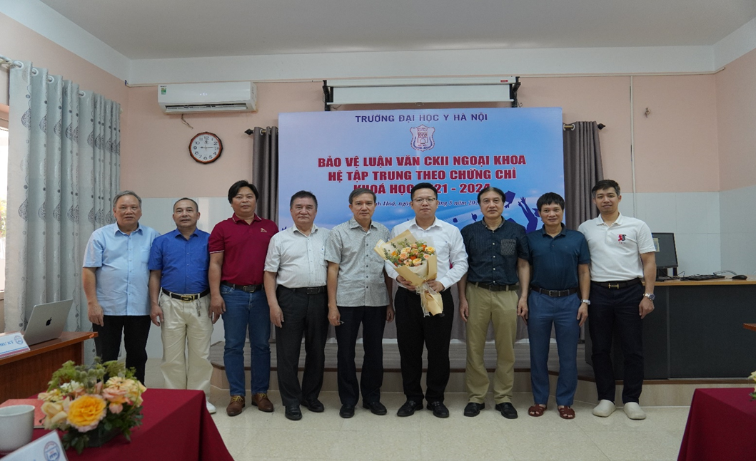 A group of men standing in front of a screen

Description automatically generated